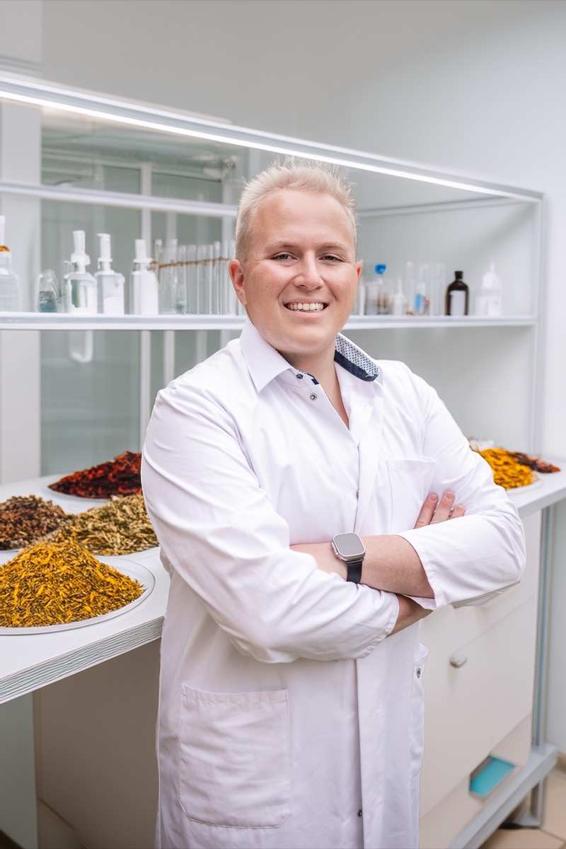 Dr. Julian Douwes reviewing peptide safety data in clinical laboratory